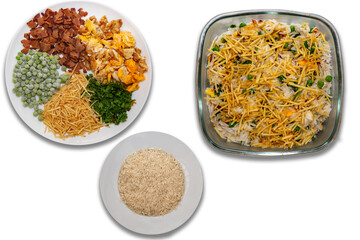 Biro-biro rice is a typical Brazilian dish to accompany or as a main course. Parsley, potato sticks, peas, egg, and bacon.  top view