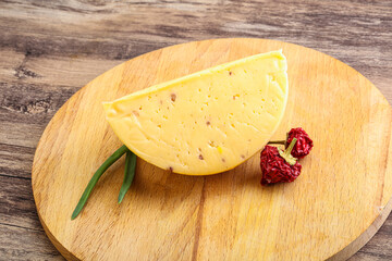 Hard cheese brick with walnut