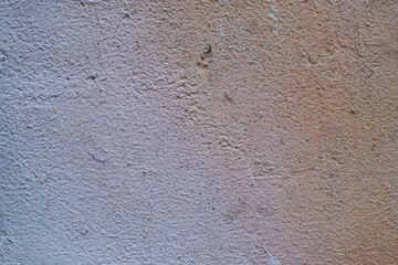 texture of a plastered and painted wall with a predominance of brown colors