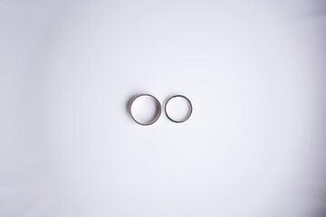 Wedding rings with white gold on a white background