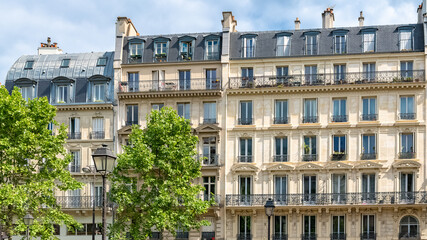 Fototapeta na wymiar Paris, typical facades and street, beautiful buildings rue du Temple 
