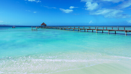 Wooden pier on dominican lagoon. Copy space, wide angel