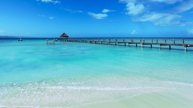 Wooden pier on dominican lagoon. Copy space, wide angel