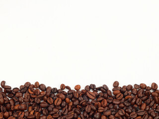 Coffee beans borders made from roasted coffee beans. Top view, close up, place for text. Blank for text.