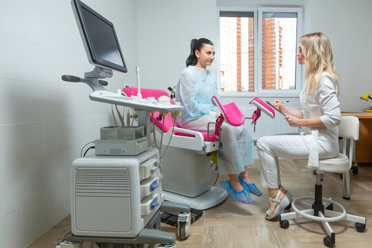 Photo of a gynecologist doctor and a patient on a gynecological chair. Preventive reception, preparation for medical examination, pregnancy management, health care gynecology contol