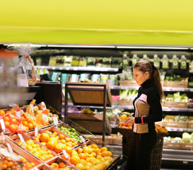 Woman buying fruits at the market