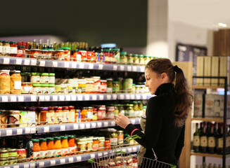 Woman choosing a dairy products at supermarket