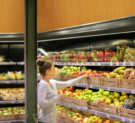 Woman buying fruits at the market