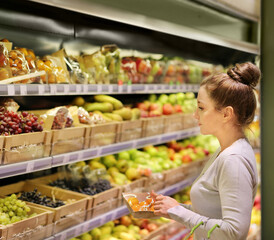 Woman buying fruits at the market