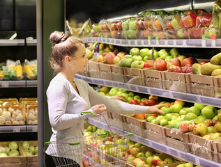 Woman buying fruits at the market