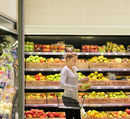 Woman buying fruits at the market