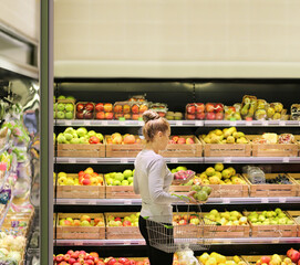 Woman buying fruits at the market