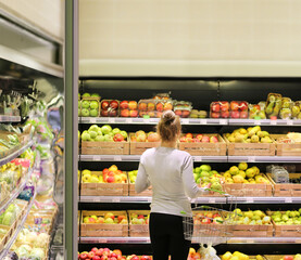Woman buying fruits at the market