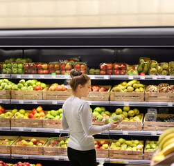 Woman buying fruits at the market