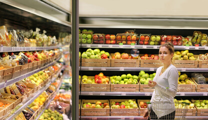 Woman buying fruits at the market