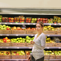 Woman buying fruits at the market