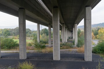 Underneath highway bridge pillars view