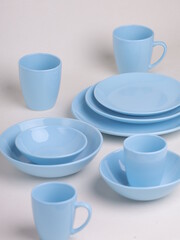 blue ceramic dishes on a light background - 475609435