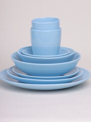 blue ceramic dishes on a light background - 475609438