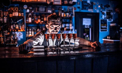 Bartender makes a cocktail on the saloon