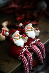 Nice Santa Claus ceramic dolls for a funny Christmas decoration in red tones.