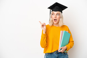 Young university caucasian woman graduate isolated on white background intending to realizes the...