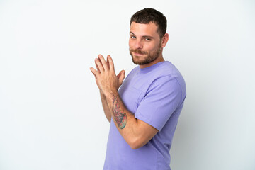 Young Brazilian man isolated on white background scheming something