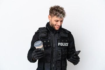 SWAT caucasian man isolated on white background holding coffee to take away and a mobile