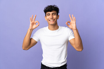 Young Argentinian man isolated on background in zen pose