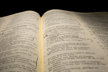 Fototapeta na wymiar open bible reflected with warm light