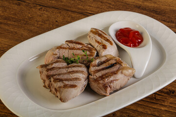 Grilled pork tenderlion with tomato sauce