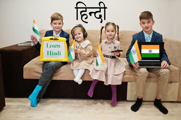 Four kids show inscription learn hindi. Foreign language learning concept. Indian flags.