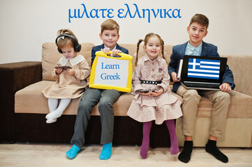 Four kids show inscription learn greek. Foreign language learning concept.