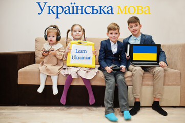Four kids show inscription learn ukrainian. Foreign language learning concept.