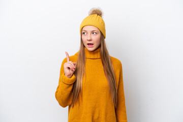 Young caucasian woman wearing winter jacket isolated on white background thinking an idea pointing the finger up