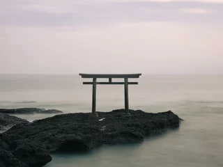 Gordijnen Ibaraki,Japan - December 17, 2021: A torii or a Shinto gateway shrine gate on the rock in the sea  © Khun Ta