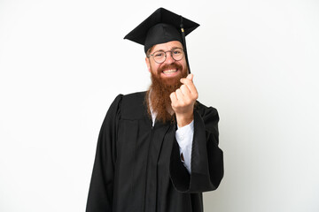 Young university graduate reddish man isolated on white background making money gesture