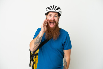 Young reddish caucasian man with thermal backpack isolate don white background shouting with mouth wide open