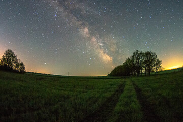 Milky Way forest in the night . Night landscape. Nightsky and clouds . Stars in the sky . 