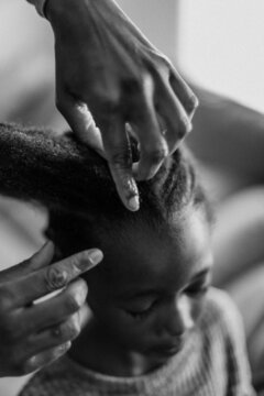 Black Girl getting hair braided