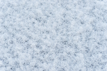 Fototapeta na wymiar Lightly piled snow on black table in Japan