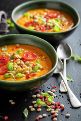 Green lentil soup made of legume vegetables and peppers.