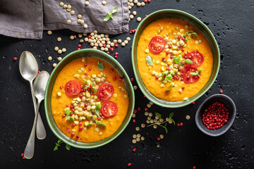 Green lentil soup with cherry tomatoes and cream.