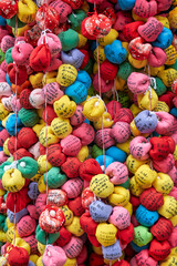 Fototapeta na wymiar Kukurizaru, colorfull balls with wishes of worshippers at Yasaka Koshin-do temple. Kyoto. Japan