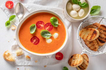 Healthy creamy tomato soup as healthy and spicy appetizer.