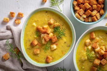 Delicious gherkins soup with croutons and dill.