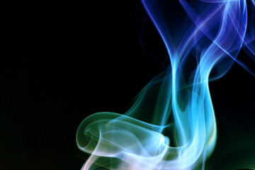 Close up of incense smoke on black background