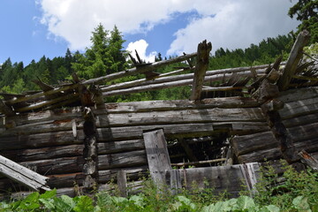 Old wooden shack ruin in the mountains