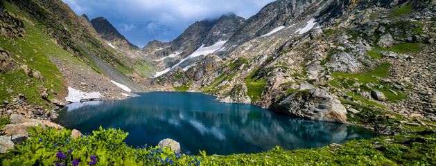 Lake in the mountains. Scenic panoramic view of Satsar lake on high altitude trek Great Lakes of...