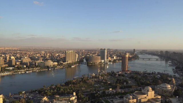 Cairo, Egypt - June 25, 2021 - aerial panorama view of the Nile with Cairo skyline at sunset seen from Cairo Tower